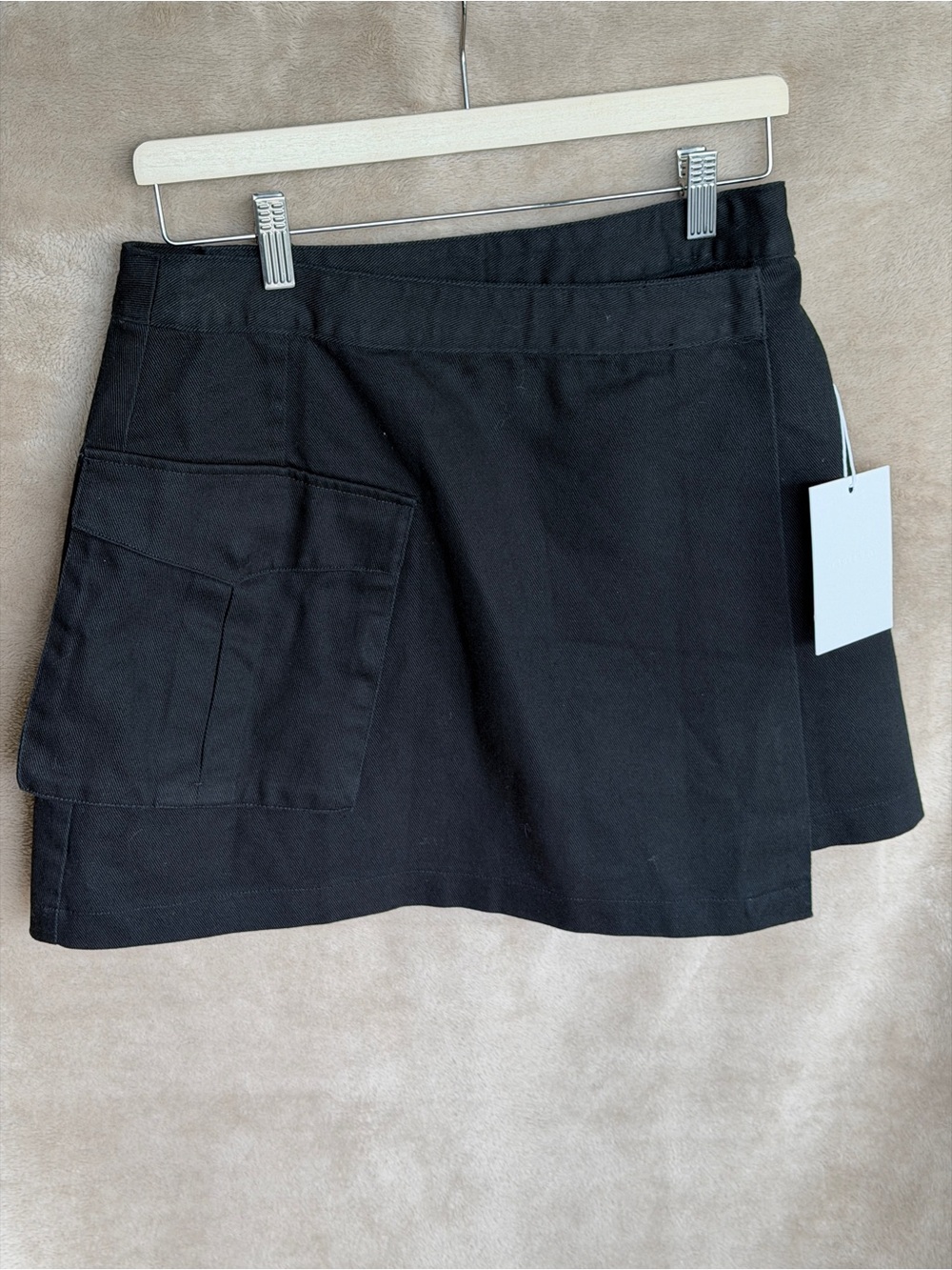 I love ugly wrap Black Mini Skirt with Front Patch Pocket